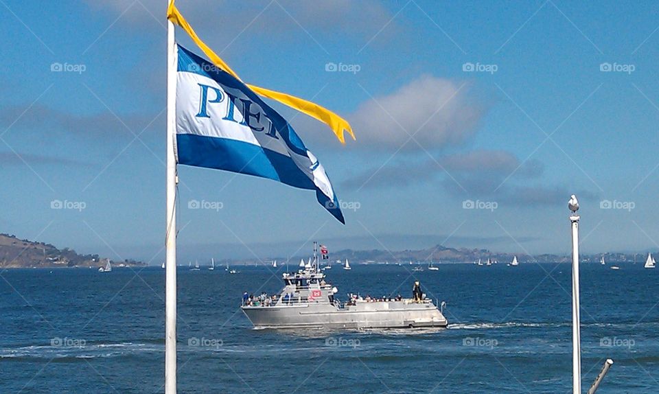 San Francisco Bay Pier 39 flag and fleet week navy ship