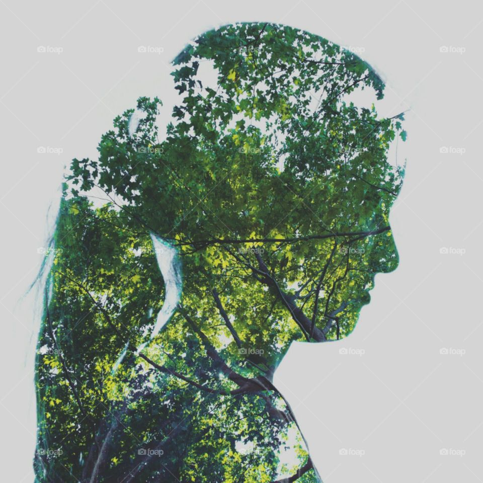 double multi exposure of spring green trees and girl woman outline