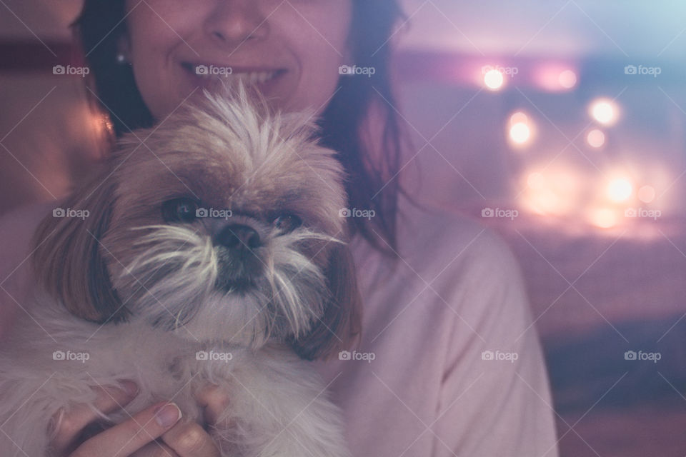 Girl hugging her cute shihtzu dog