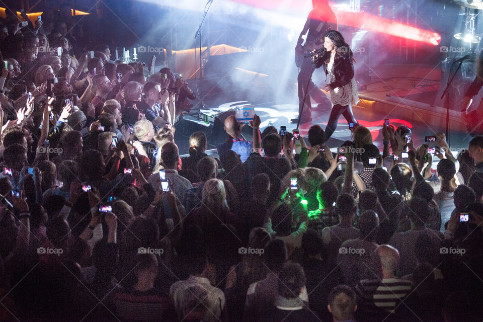 Swedish superstar Carola Häggkvist performing on stage in a nightclub in Malmö.