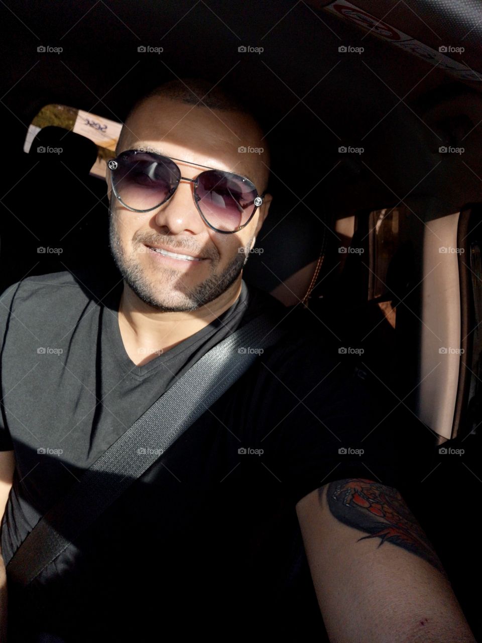 Man smiling with sunlight illuminating his face