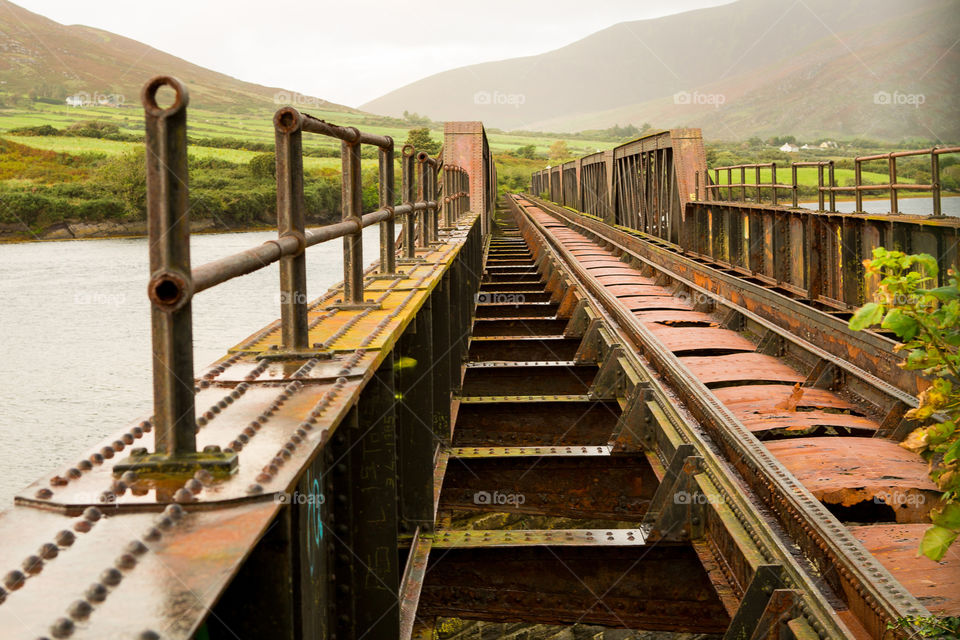 Leading lines is key to this composition. Railway with steps and tracks leading into the distance.