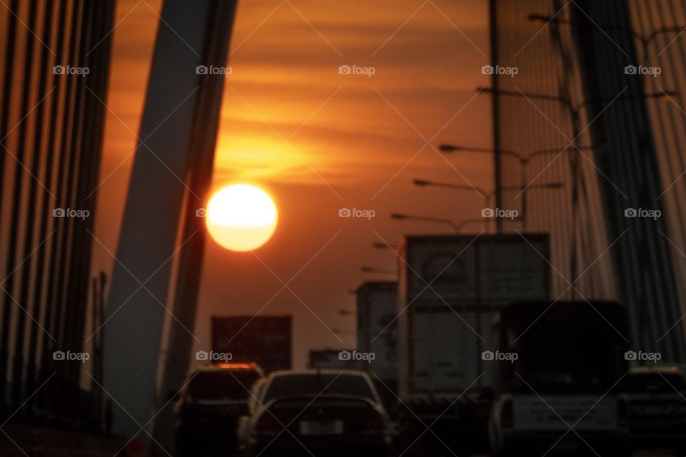 Sunset on the bridge in the big city