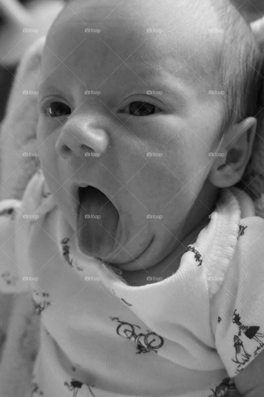 Close-up of a cute baby with mouth open