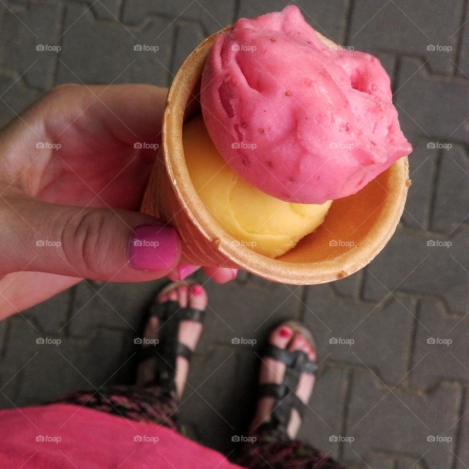 Hand holding ice cream. Hand holding ice cream