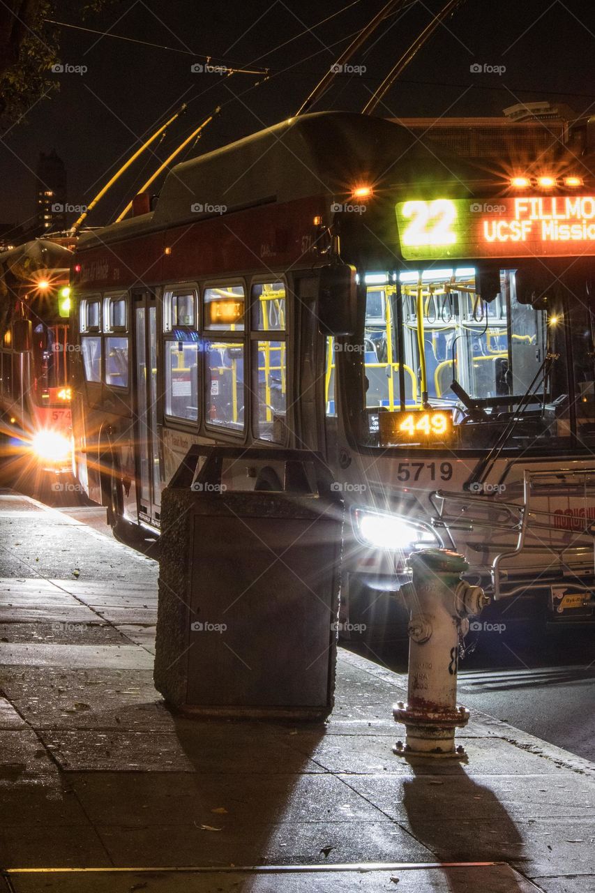 22 Fillmore bus at night in San Francisco on Fillmore Street and Bay Street at the bus stop 