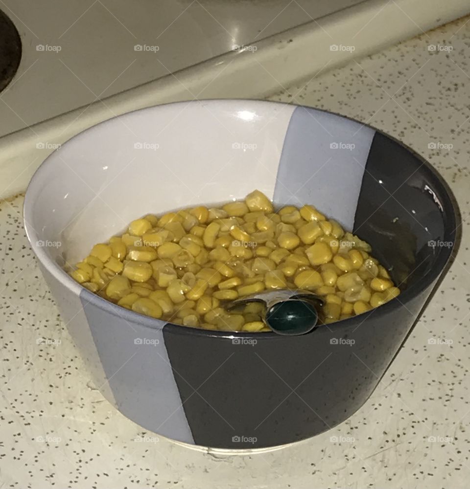 A bowl of corn kernels.