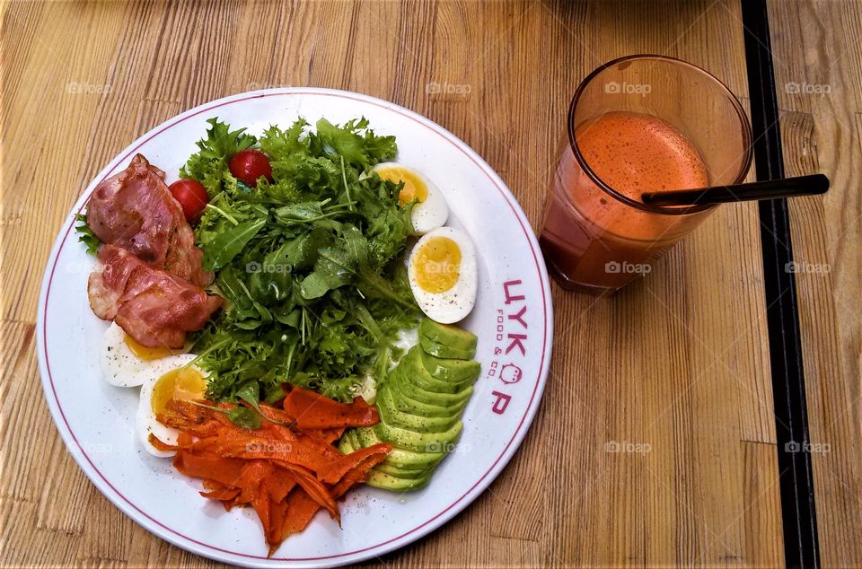 Healthy salad and carrot juice.

The salad contains:
-boiled eggs
-sweet potato
-avocado
-bacon
-green salad
