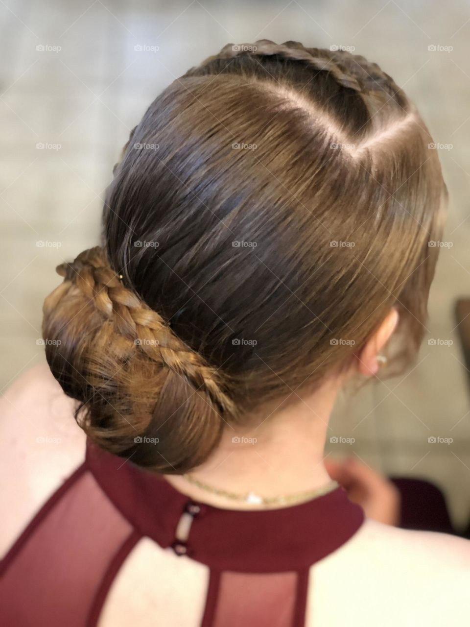 Girl ready for prom with brown braided hairstyle