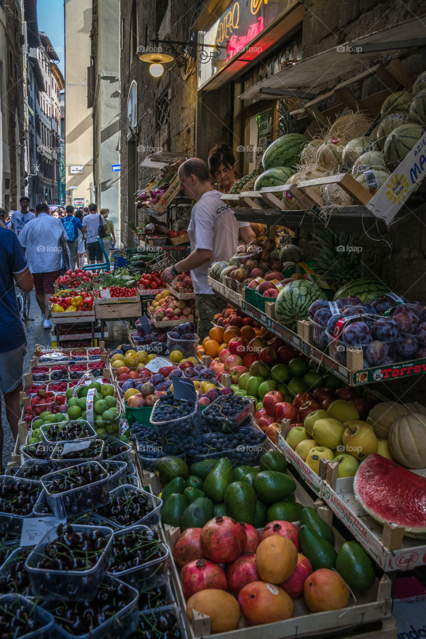 Fresh foods at a market. Fresh fruits and vegetables and a farmers market in Italy