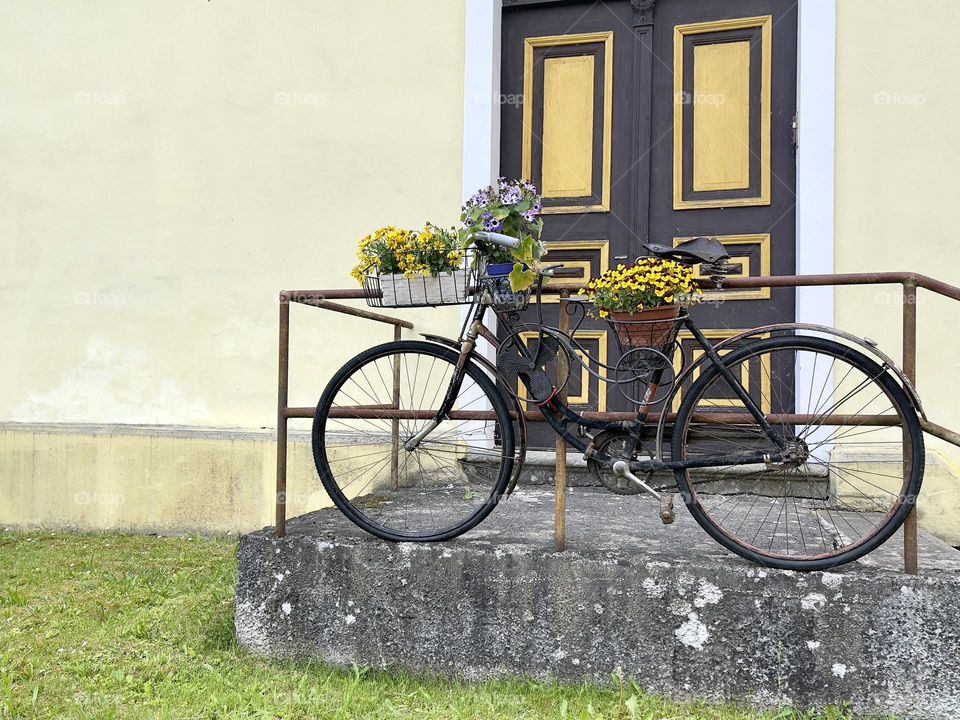 Bicycle with yellow flowers outdoor 