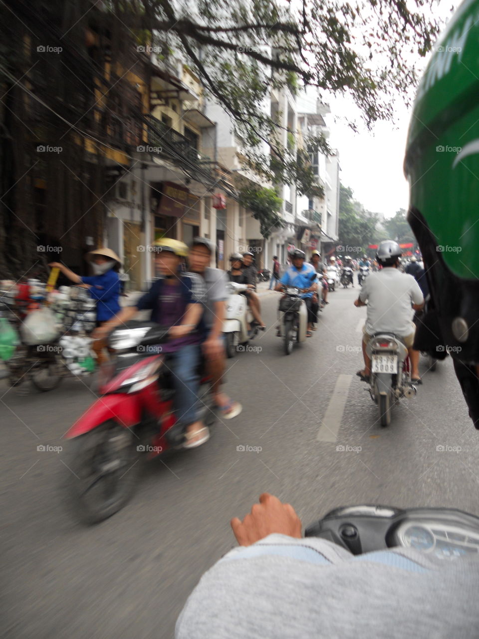 Zipping through the crazy streets of Hanoi Vietnam the way the locals do
