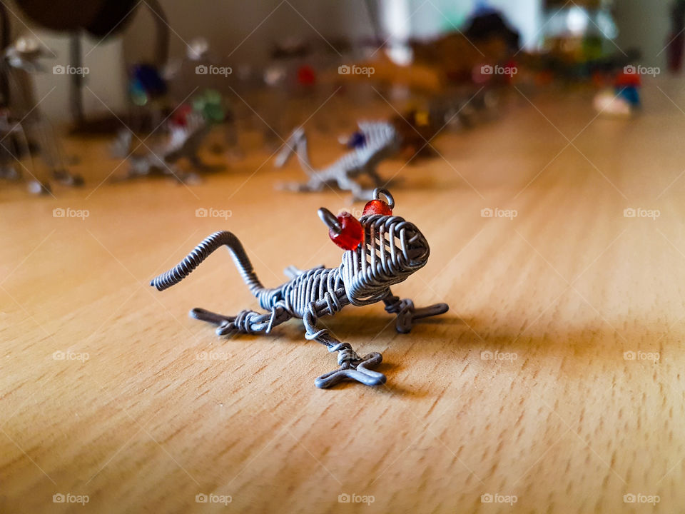 metal lizzard with beed eyes