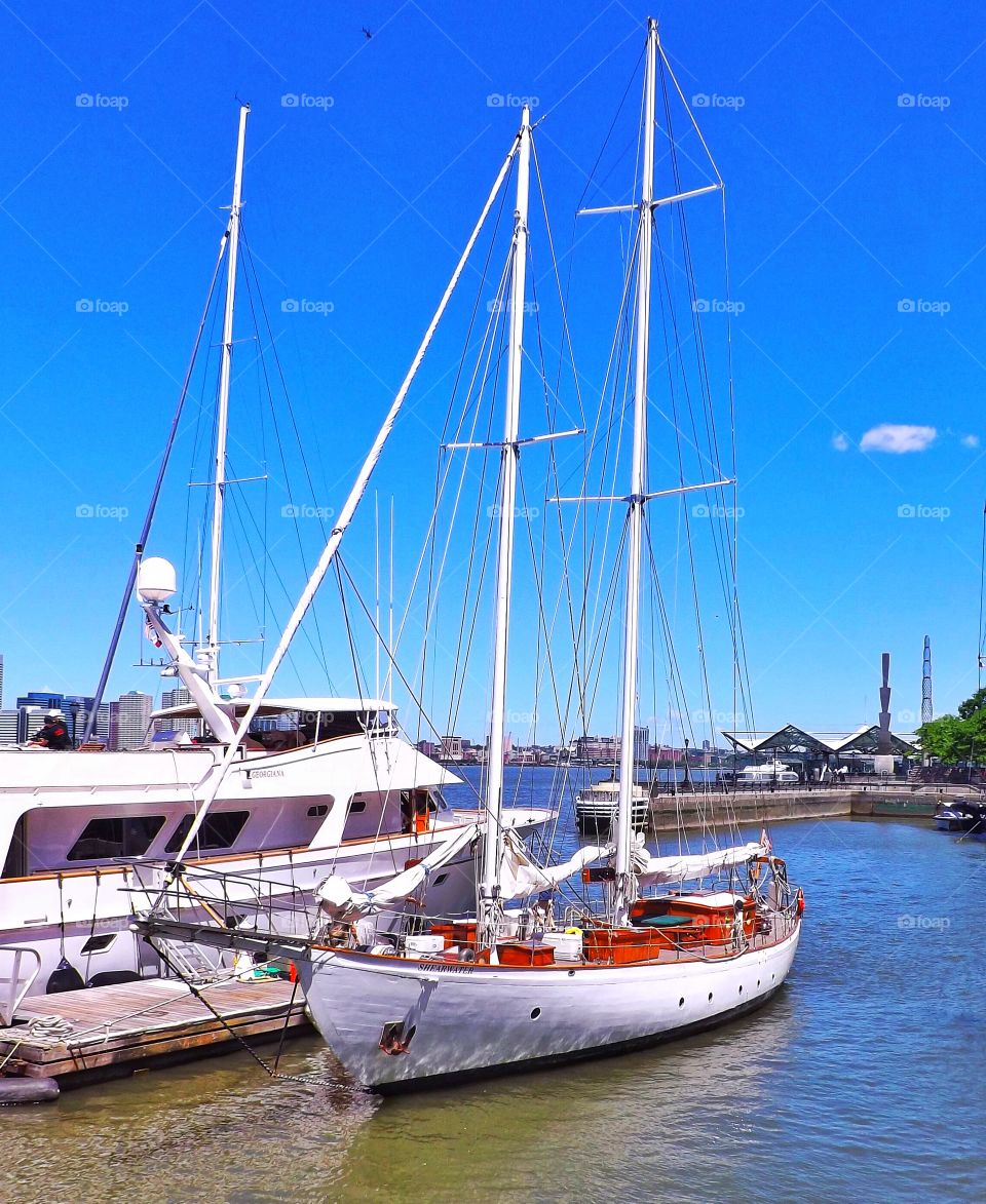 Boats moored at harbor in Hudson river