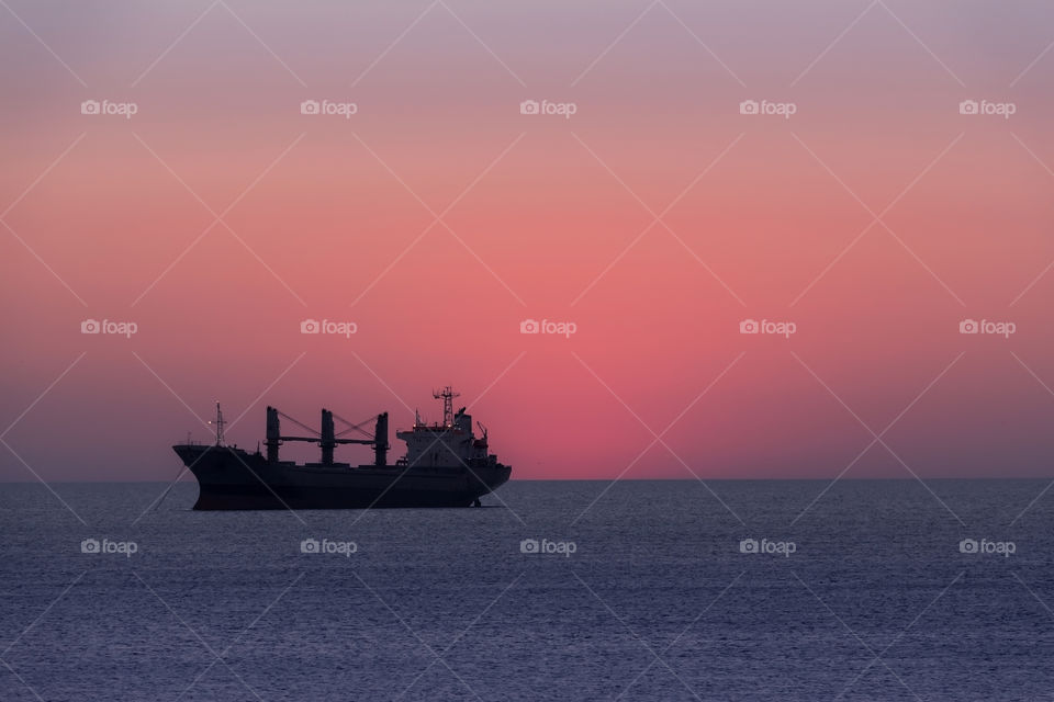 Beautiful view of ship against of colourful sky at golden hour time