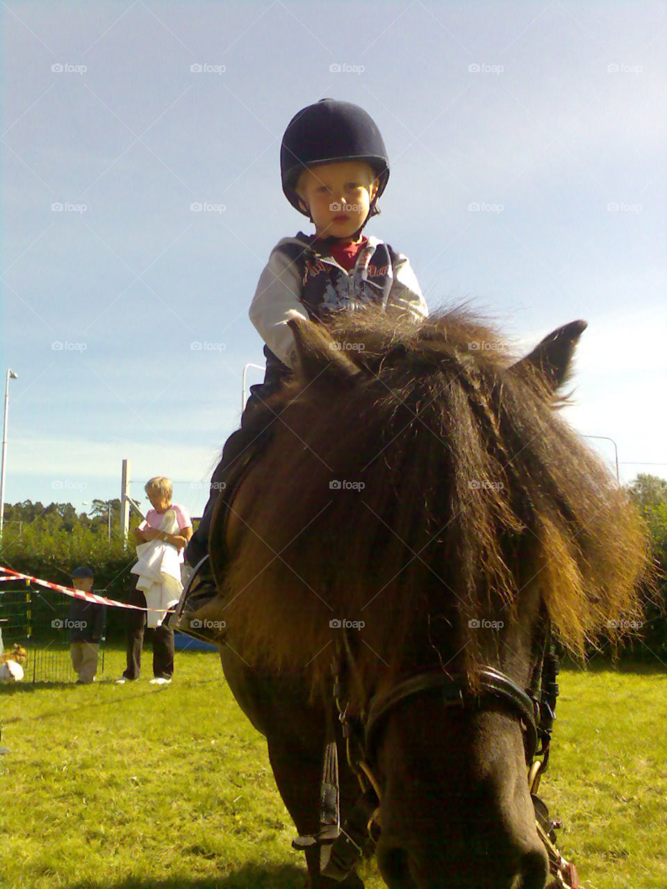 My first ride!. Child riding a house for the first time.