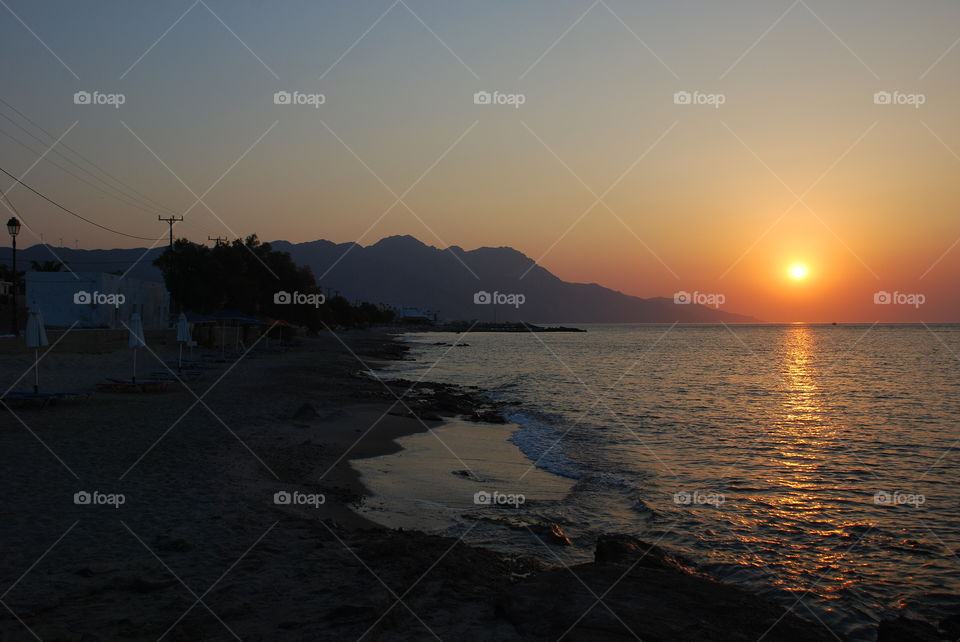 Spectacular sunrise  on Kardamena beach in Kos island, Greece