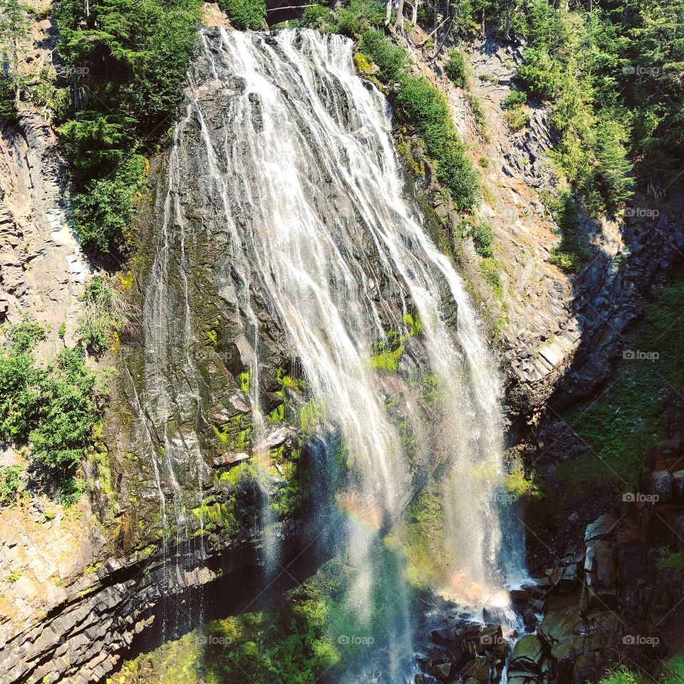 Stunning rainbow in a waterfall 