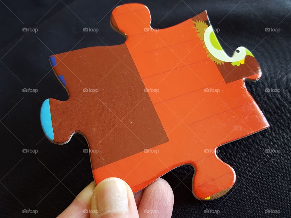 Man holding puzzle piece