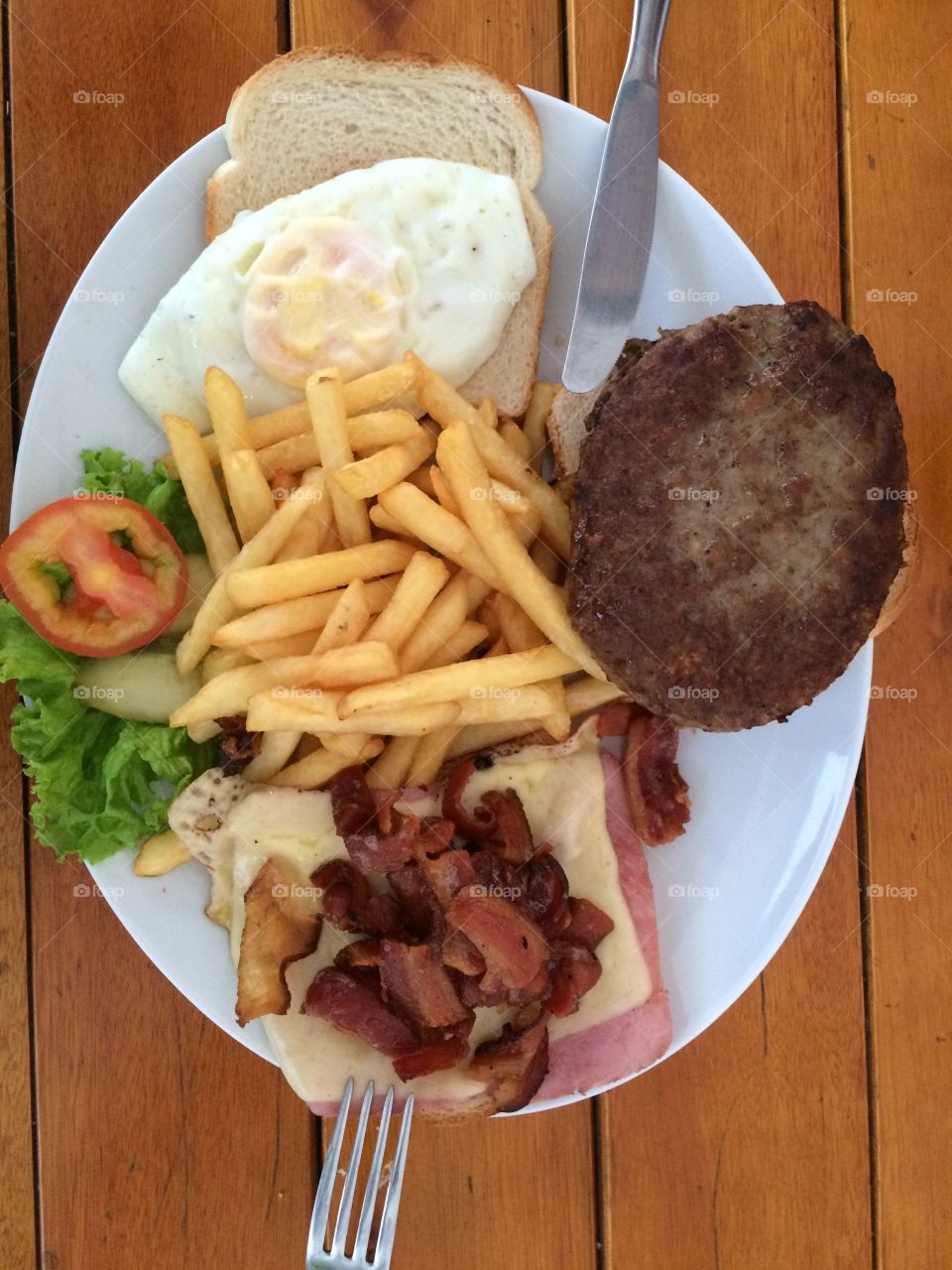 Plate served with meat, fries and salad