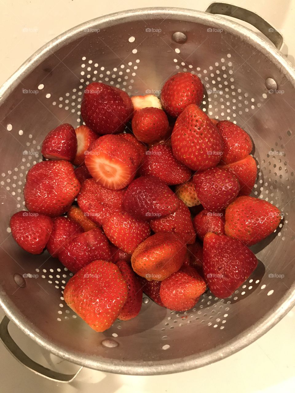 Just rinsed strawberries in a colander 