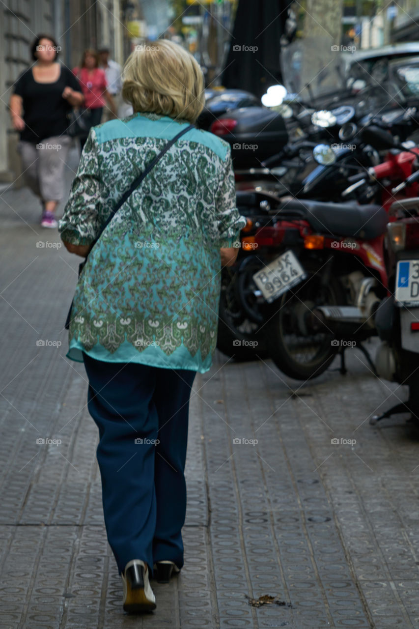 Elderly Woman among Motorcycles