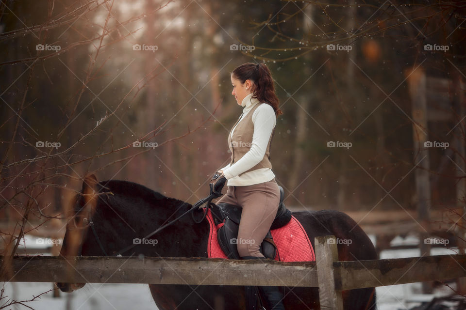 Young beautiful woman with horse outdoor portrait at spring day