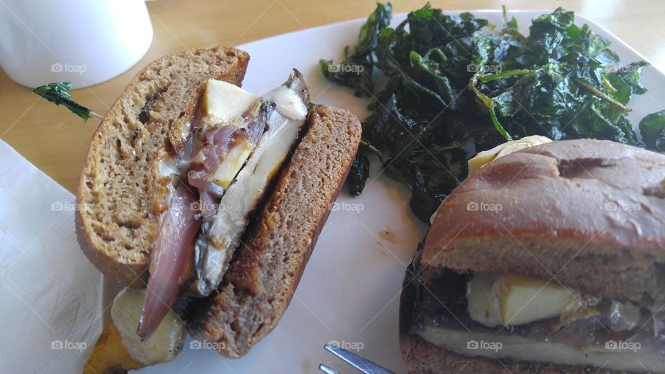 Portobello Burger with Sweet Onion and Artichoke with a side of Fried Spinach