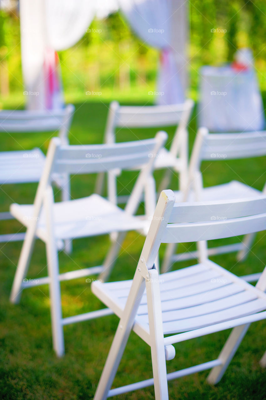 Empty chairs in garden