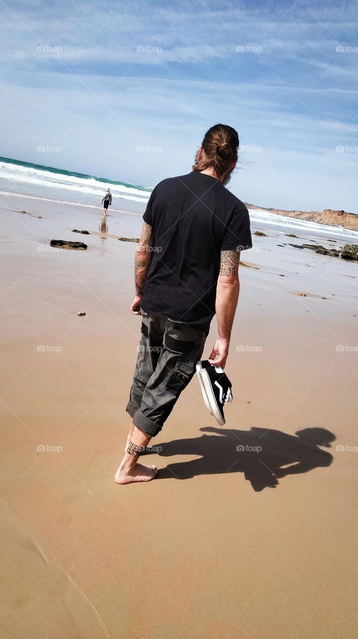 Man walking on the sand