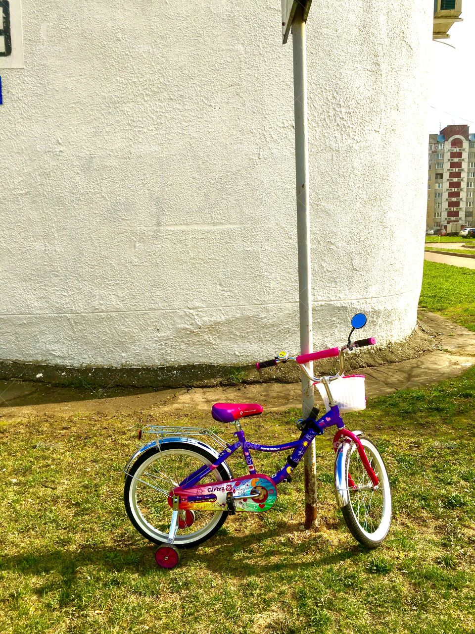 children's bicycle near the pillar