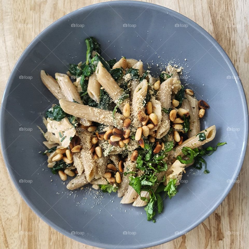 Nicely plated pasta, with greens and vegan sauce.