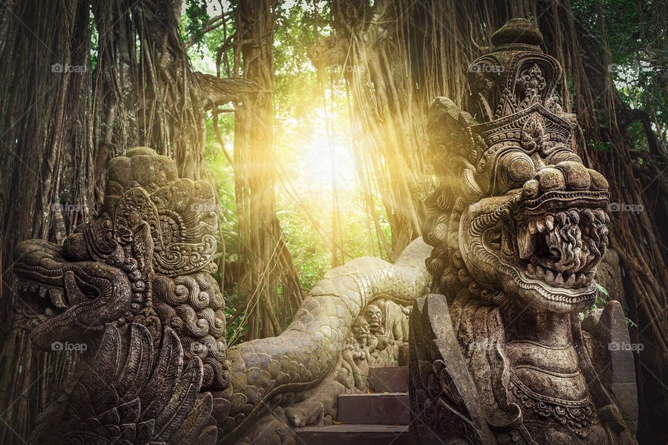 Bridge with statues in Sacred Monkey Forest in Ubud, Bali