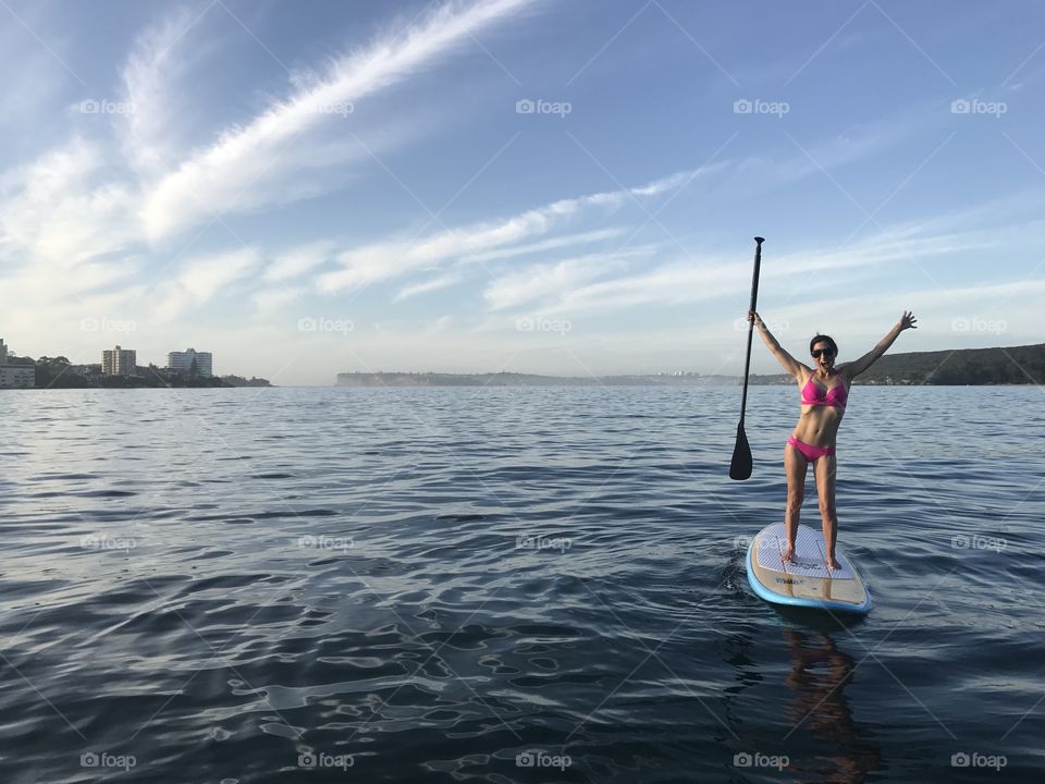 Paddle boarding at dusk in Sydney 