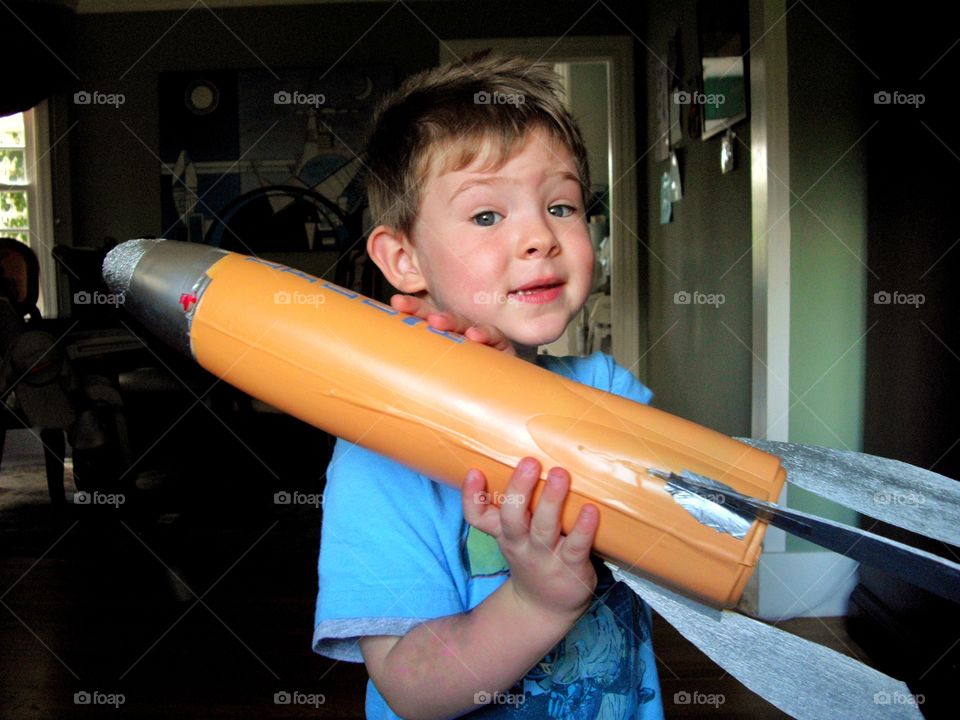 Young Boy With His Model Rocket
