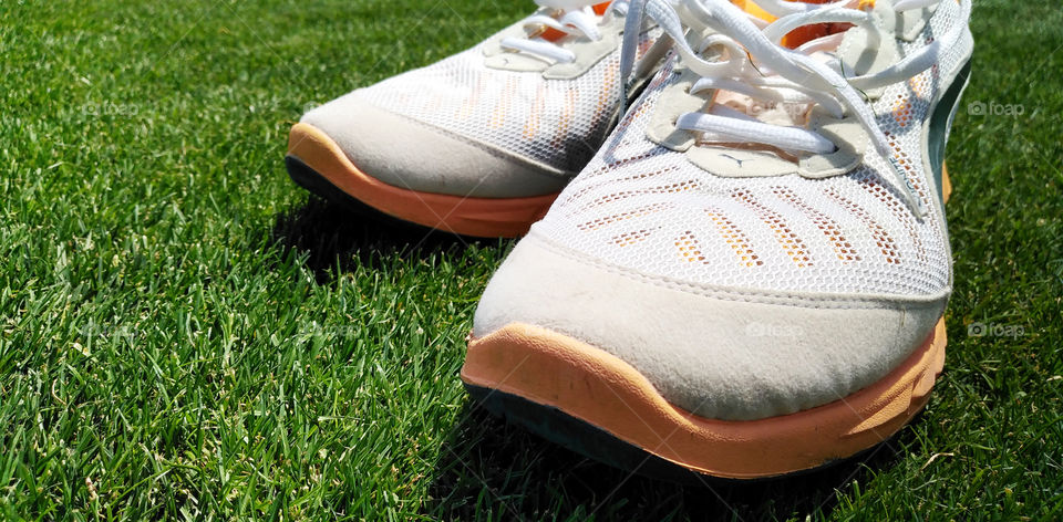 Puma shoes on green football yard
