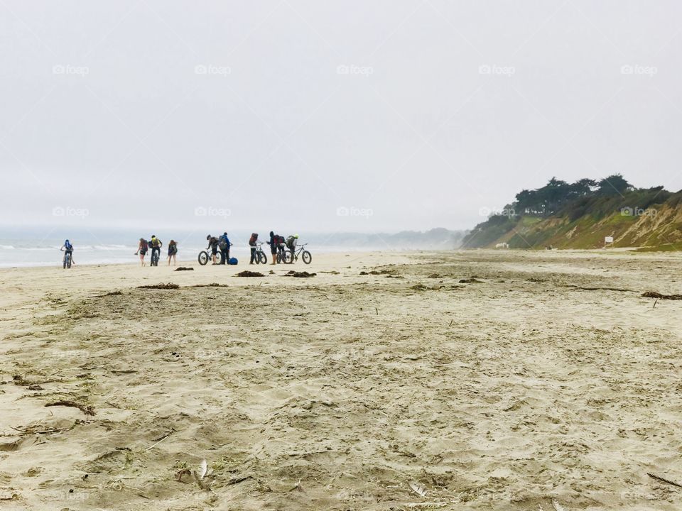 Bicycles ride along the seashore with Friends 