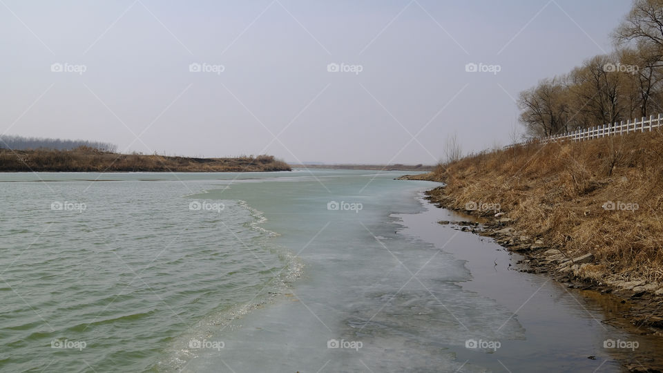 The ice on the river is melting