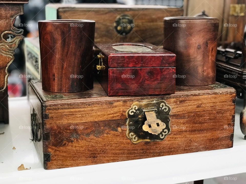 Ancient wooden boxes and wooden measuring glasses 