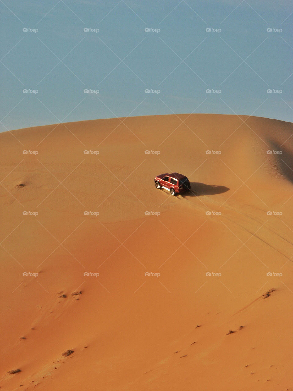 car driving sand desert by chrisc