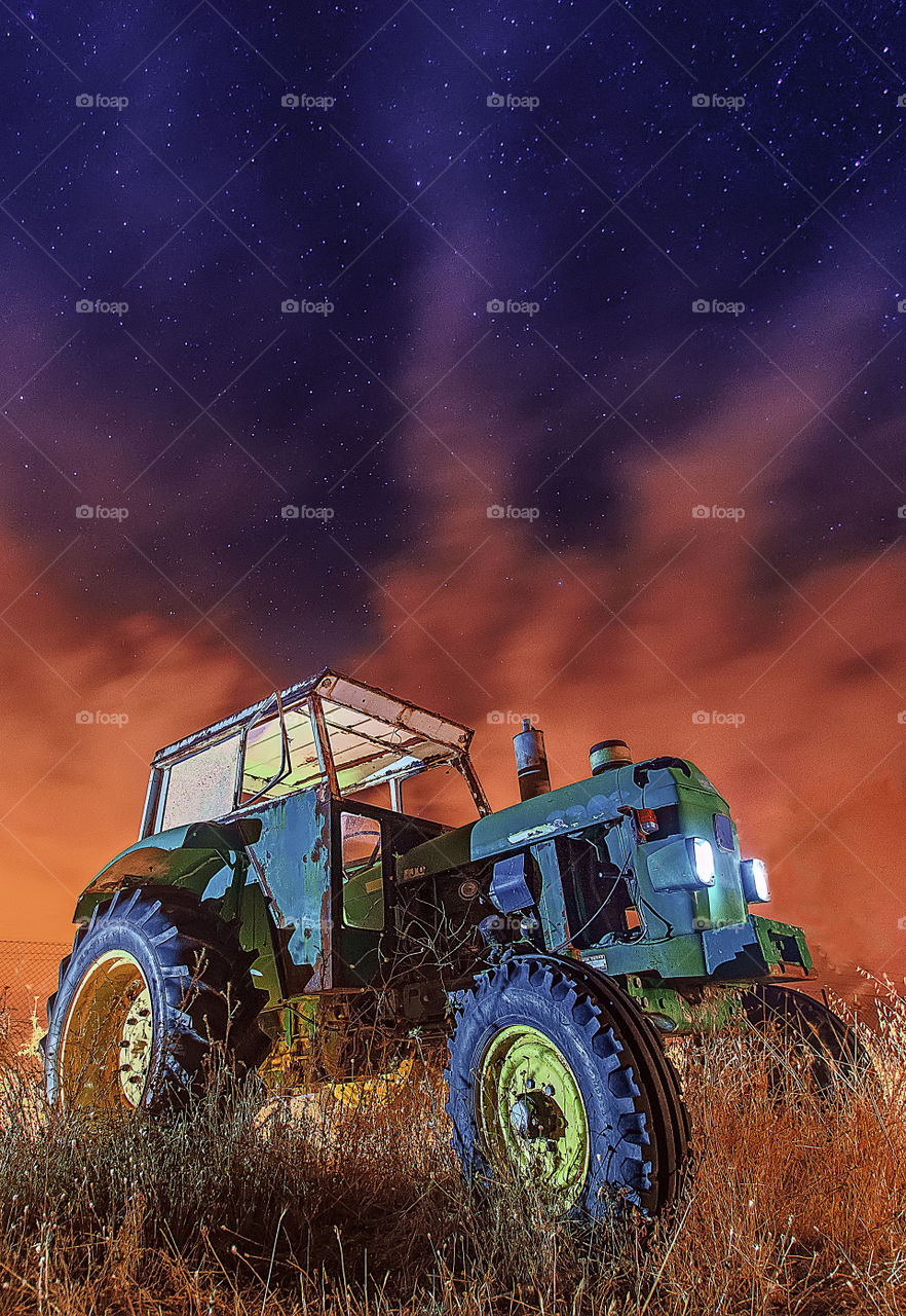 The tractor and red sky