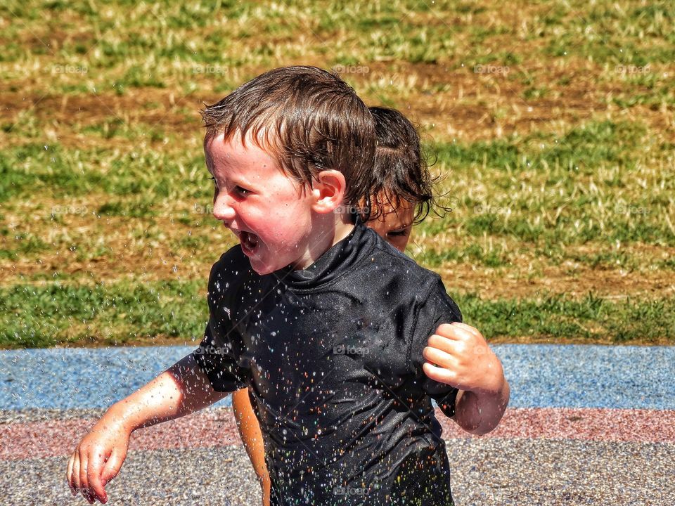 Kids Playing In Water