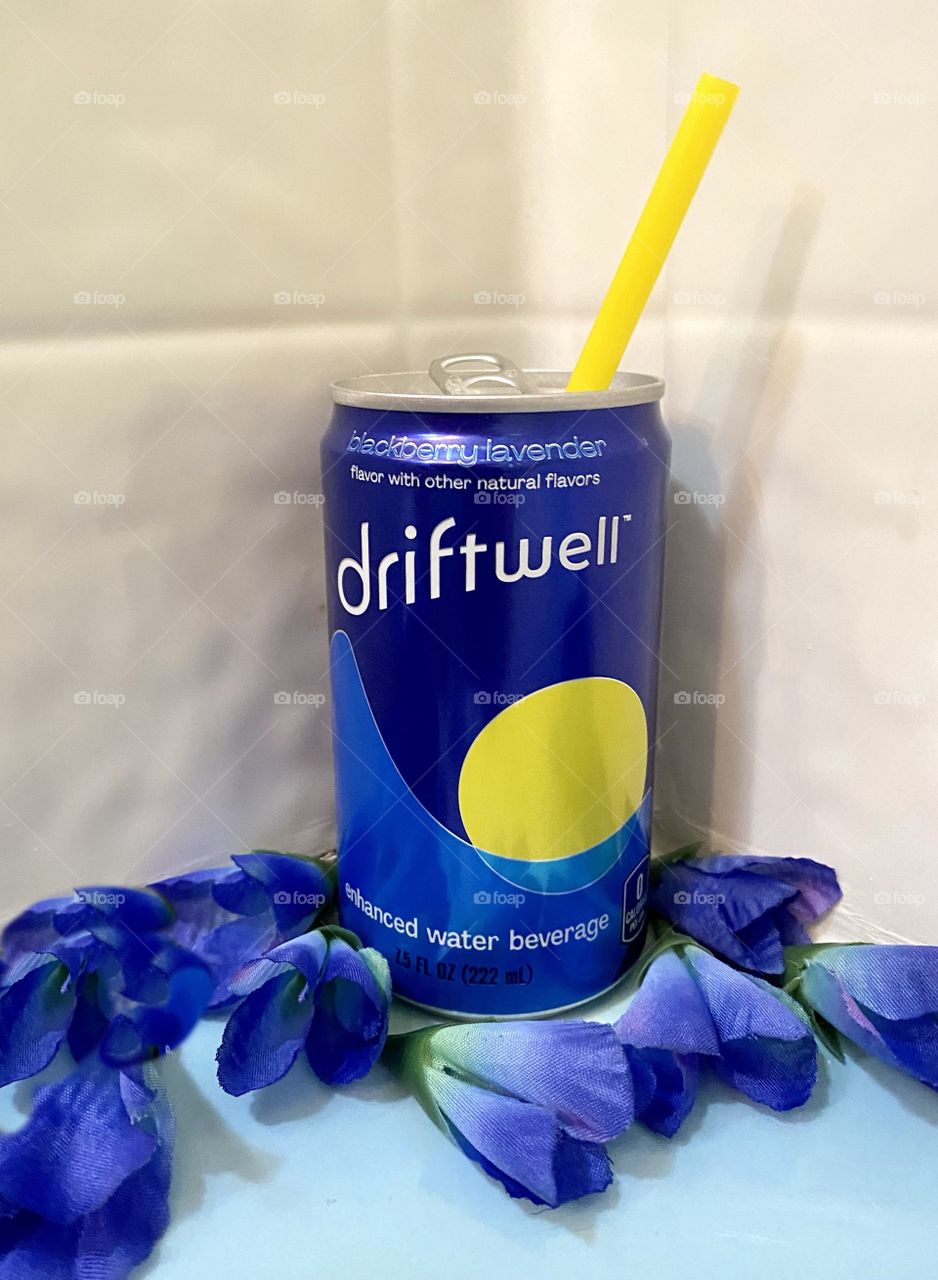 Driftwell with blue flowers and yellow straw