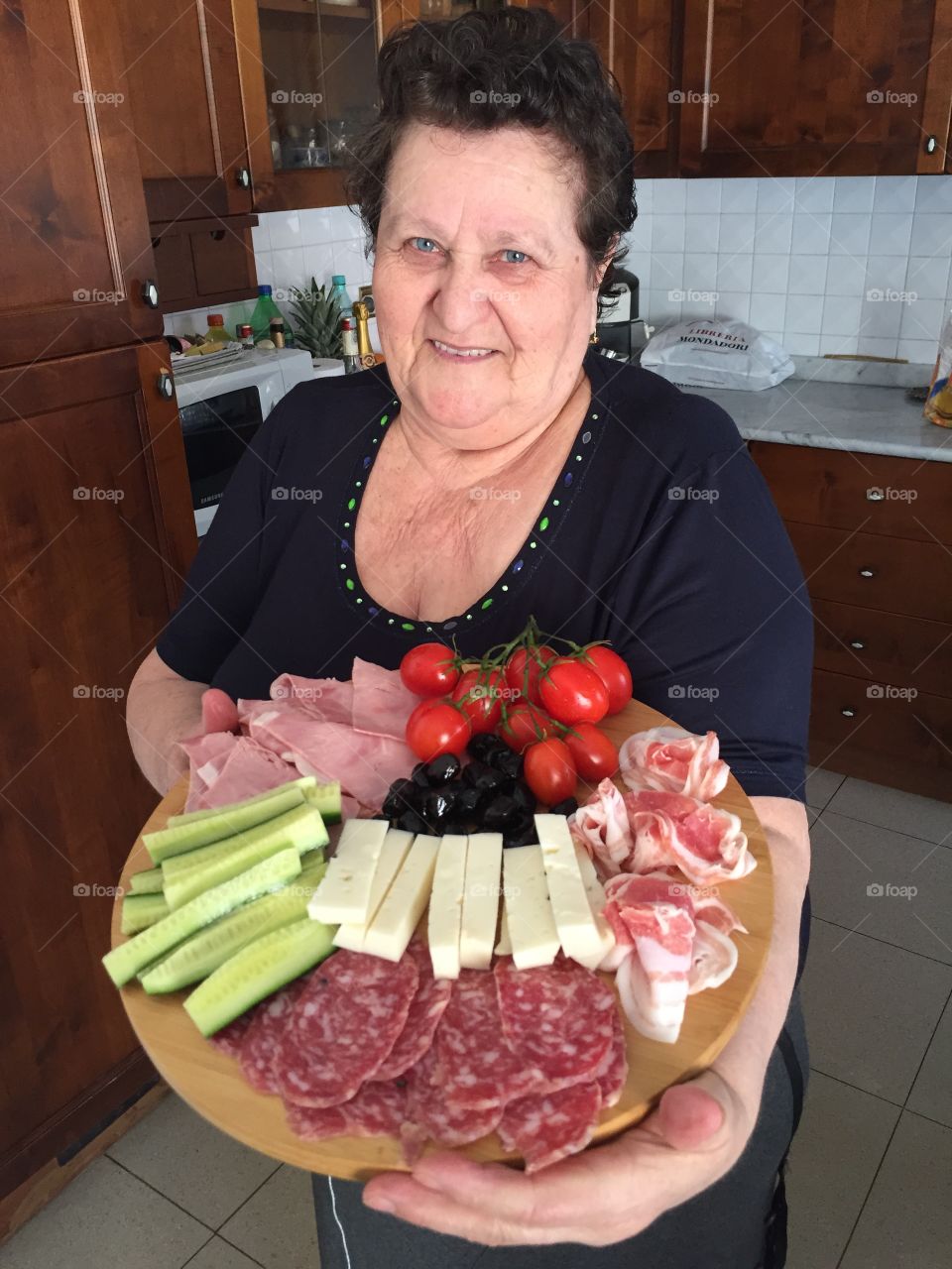 Grandmother with appetizers ready for the romanian Easter lunch