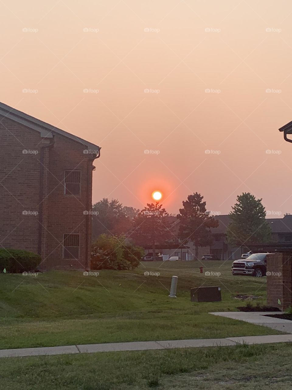 Smoke filled sky during sun set. Hazey sunset