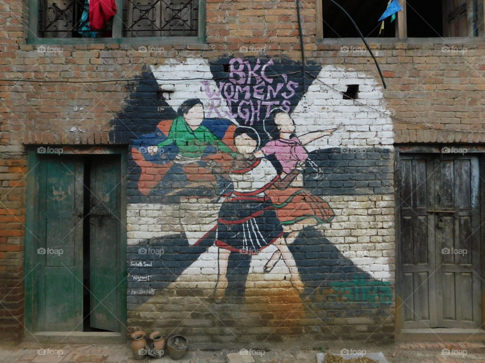mural on brick wall in nepal