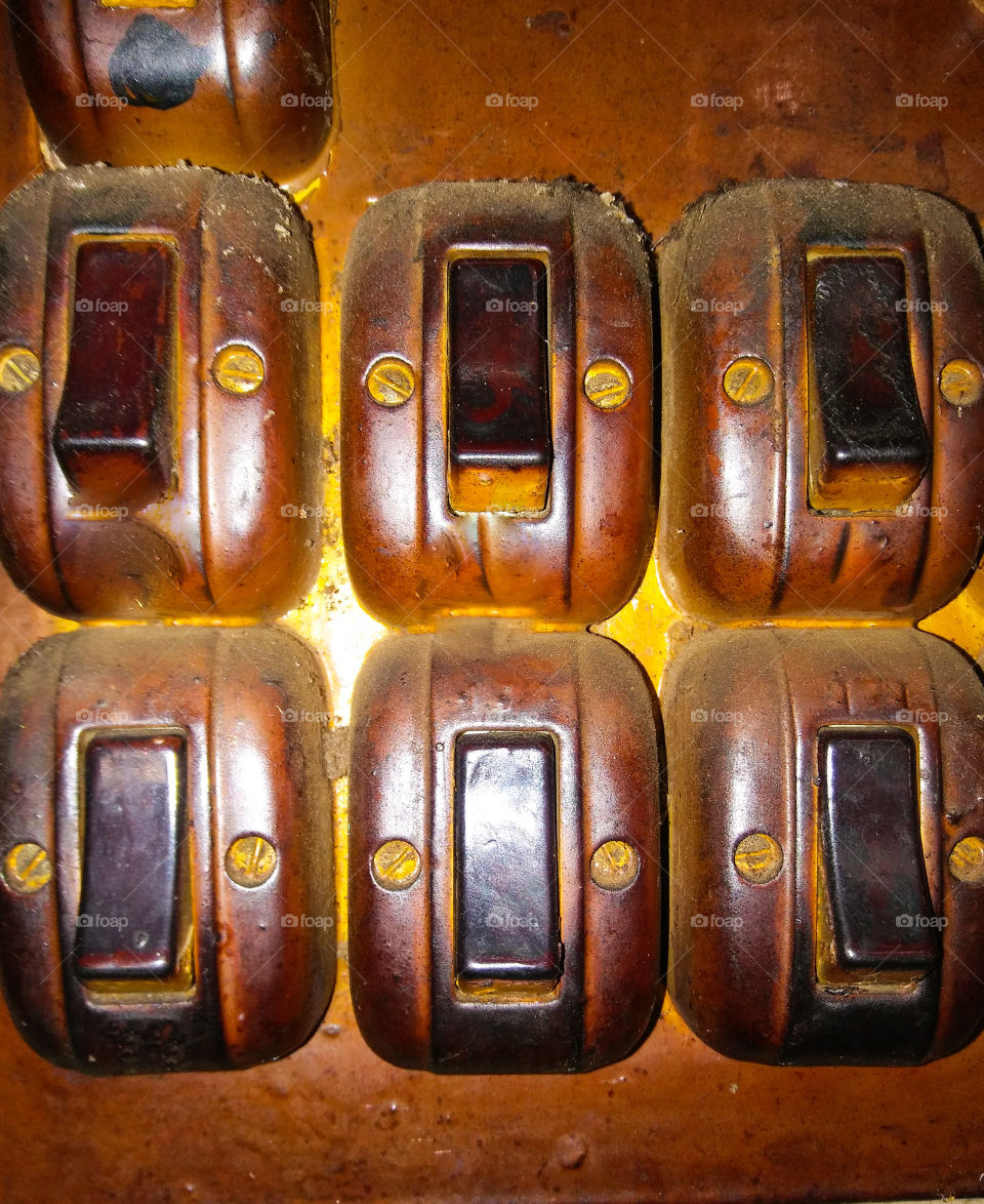 Old fashioned switches on panel.