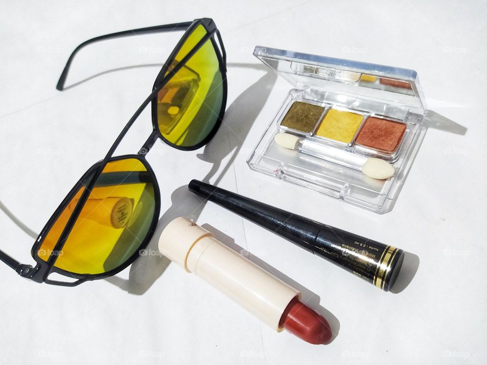 Sunglasses, lipstick, eyeliner, eyeshadow, isolated on white background, makeup tools