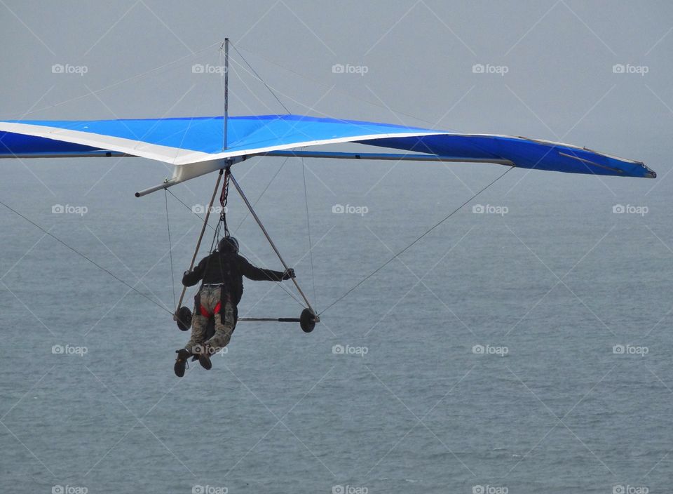 Hang Glider Over The Ocean