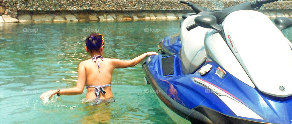 Summer swimming riding jetski